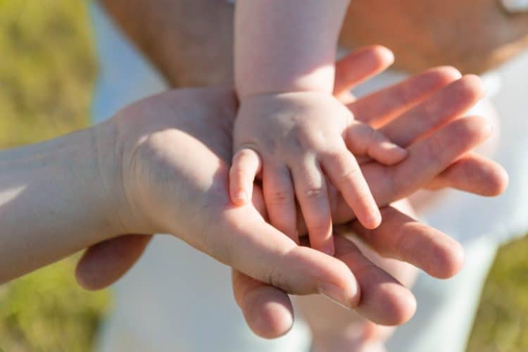 Photo by Samuel Dostál from Pexels: https://www.pexels.com/photo/close-up-photo-of-baby-s-hand-on-parent-s-hands-6540658/