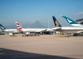 Photo by 分 参 from Pexels: https://www.pexels.com/photo/commercial-airplanes-parked-at-busy-airport-36960199/