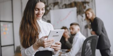 Photo by Gustavo Fring from Pexels: https://www.pexels.com/photo/woman-in-white-long-sleeve-top-holding-a-tablet-4872048/