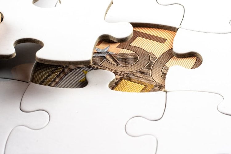 Photo by Mike van Schoonderwalt from Pexels: https://www.pexels.com/photo/money-under-a-white-puzzle-5484677/