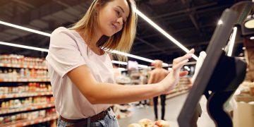 Photo by Gustavo Fring from Pexels: https://www.pexels.com/photo/cheerful-woman-using-electronic-scales-in-supermarket-4173320/