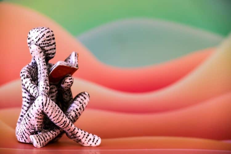 Photo by Magda Ehlers from Pexels: https://www.pexels.com/photo/artistic-sculpture-of-reading-figure-with-book-34725990/