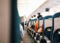 Photo by Pew Nguyen from Pexels: https://www.pexels.com/photo/people-sitting-on-blue-seats-inside-an-airplane-11989285/