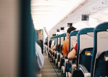 Photo by Pew Nguyen from Pexels: https://www.pexels.com/photo/people-sitting-on-blue-seats-inside-an-airplane-11989285/
