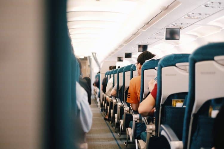 Photo by Pew Nguyen from Pexels: https://www.pexels.com/photo/people-sitting-on-blue-seats-inside-an-airplane-11989285/