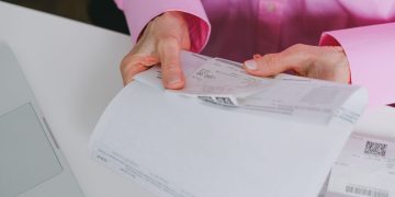 Photo by SHVETS production from Pexels: https://www.pexels.com/photo/person-holding-a-receipt-7545333/