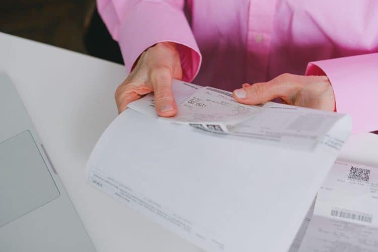 Photo by SHVETS production from Pexels: https://www.pexels.com/photo/person-holding-a-receipt-7545333/